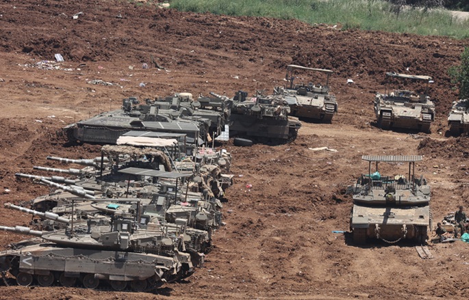 Hezbollah surmaa israelilaisen upseerin Libanonissa, Israel tappaa neljä. 1